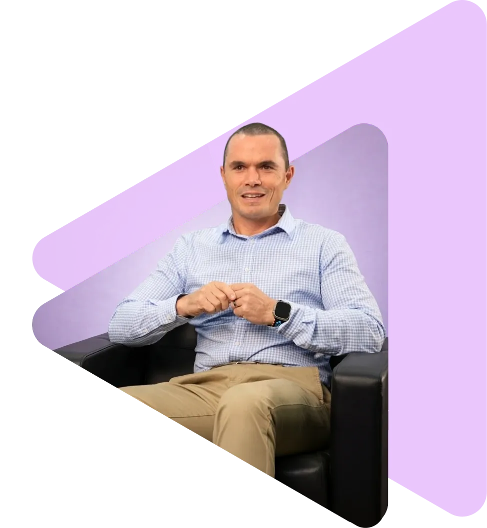 about-us-brett-in-chair-new